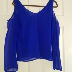 Blue open shoulder shirt.